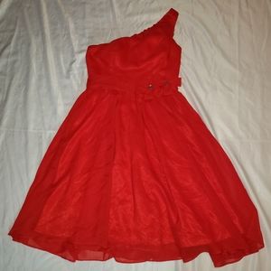 Red knee length dress with flowers details on the waist and one shoulder